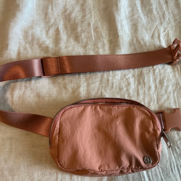 lululemon athletica Handbags - Lululemon light pink/coral color belt bag everywhere